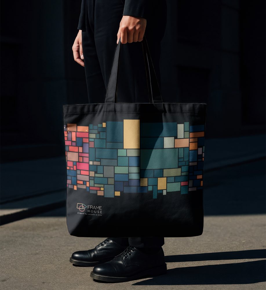 Frame House tote bag front, printed with a colored grid pattern encoding each movie's frame style